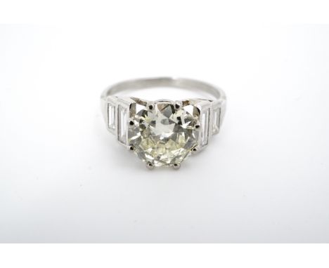 An Art Deco 2.09 ct diamond solitaire ring, the brilliant-cut diamond crown-set and flanked by baguette-cut diamond shoulders