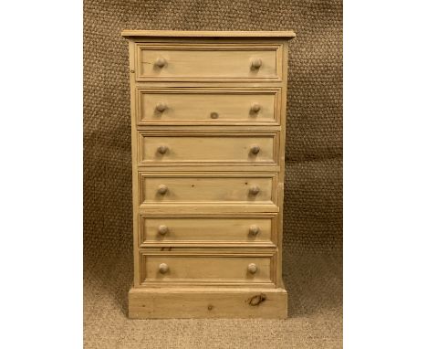 A contemporary slender pine chest of drawers, 60 cm x 37 cm x 106 cm