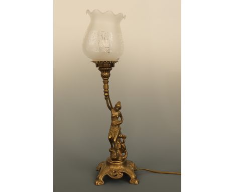 An Art Nouveau style brass figural table lamp, modelled as a young lady holding aloft a torch, with etched glass shade, 49 cm