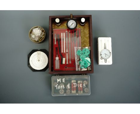 A small group of parts, gauges, taps dies and other tools and materials used in model engineering