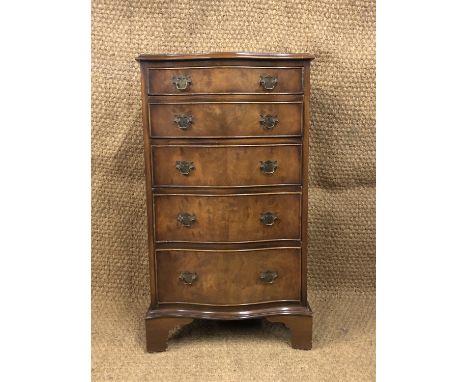 A reproduction Georgian serpentine-fronted mahogany chest of drawers of diminutive stature, 53 cm x 42 cm x 94 cm