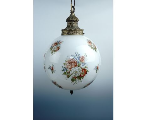 A large spherical glass pendant ceiling light with brass mounts