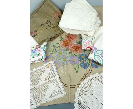 Vintage hand-embroidered domestic linens, including a linen wall hanging depicting a vase of flowers, embroidered tea table c