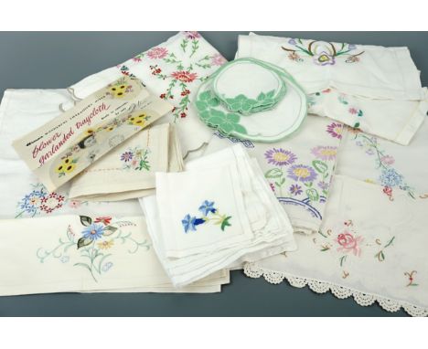 A quantity of vintage colourful hand-embroidered table linens, including cloths, napkins and coasters, second quarter 20th Ce