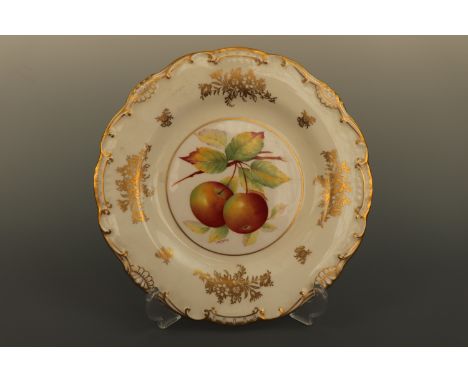 A Minton hand enamelled and gilt plate depicting an apple bough, decorated by W. R Tipton, 23 cm