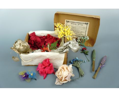A vintage Woolland Bros of Knightsbridge London carton containing a lady's collection of floral hat / millinery adornments