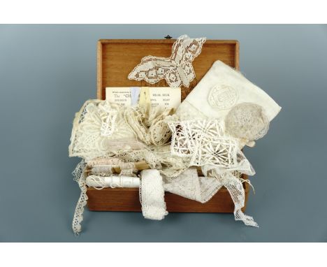 A vintage Hidalgo Premier tobacco box containing a collection of lace dress trimmings