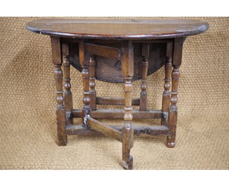 An early 18th Century joined-oak gate leg table of diminutive stature, 90 × 91 × 67 cm high