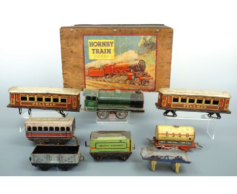 A small quantity of vintage tinplate O-gauge model railway, comprising 490 locomotive, Mettoy Railways tender, Esso and other