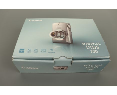 A Canon Digital IXUS 700 camera, in original box with manual and charger