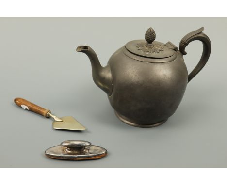 A silver nail buff, a Victorian Britannia metal bullet-form teapot by Dixon of Sheffield and an electroplate butter trowel