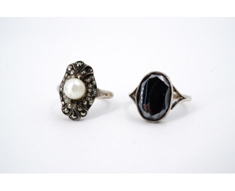 Two vintage dress rings, including a marcasite and faux pearl ring with yellow-metal and white-metal shank, stamped 9ct and s