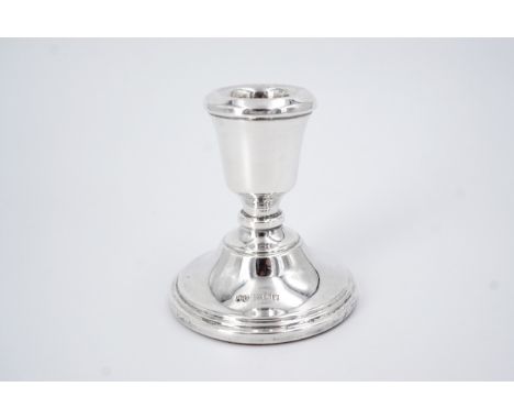 An Elizabeth II silver candlestick, Hampton Utilities, Birmingham, 1973, loaded