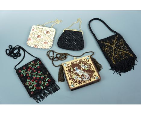 A collection of vintage beaded and tapestry purses, including one satin stitched and goldwork embroidered with a tropical bir