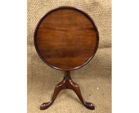 A quality reproduction mahogany snap-top wine table, having a tray top, triple-cluster column and cabriole tripod legs with s