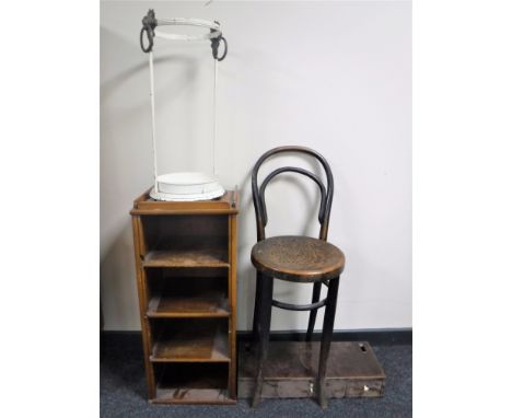 A metal lion mask stick stand together with a set of mahogany open shelves, a part dressing table mirror, rush seated stool, 