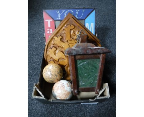 An old wooden lamp together with globe balls, carved plaques, mirror etc 