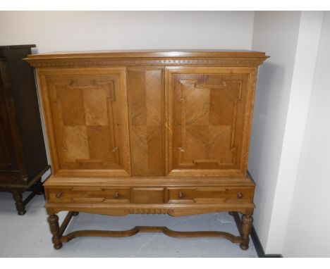 A continental light oak sideboard on stand 