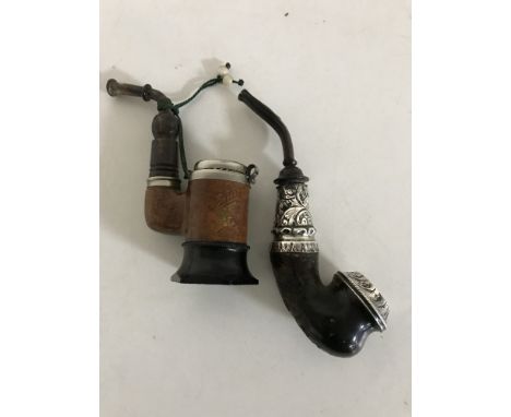 A pipe with silver mounts together with another pipe