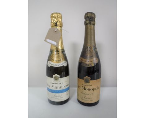 Two vintage bottles of Heidsieck & Co. Dry Monopole champagne CONDITION REPORT: These are half bottles. 