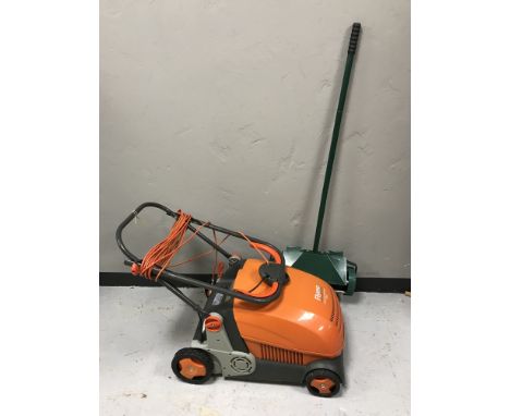 A Flymo lawn rake compact and a lawn Erator 