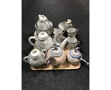 A Japanese eggshell tea service together with a Morgan Hall pottery teapot and sugar basin