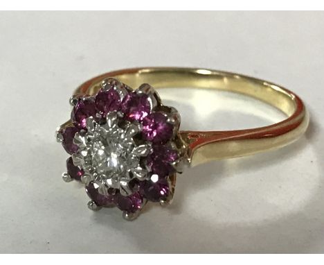 An 18ct gold ruby and diamond cluster ring, size O/P