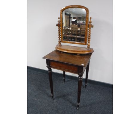 A Victorian mahogany occasional table on reeded legs together with a Victorian mahogany dressing table mirror