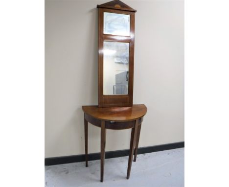 A late 19th century inlaid mahogany d-shaped hall table with mirror