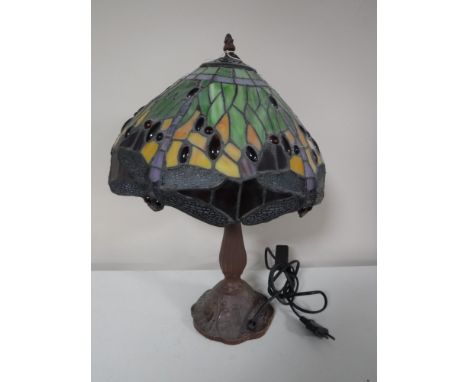 A Tiffany style table lamp with dragon fly leaded shade 