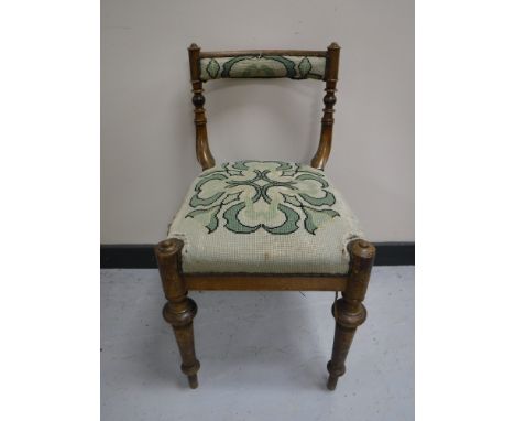 A 19th century mahogany dressing table chair upholstered in a tapestry fabric