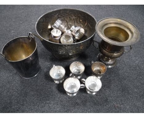 An early twentieth century embossed punch bowl with ladle and cups together with two plated wine buckets 