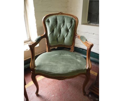 A French walnut framed armchair in green button dralon 