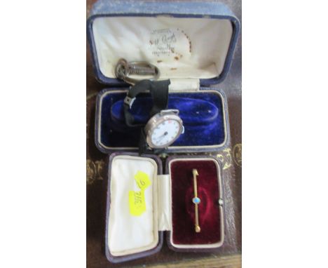 A 15ct gold bar brooch, set with an opal, weight 2g, together with a silver cased wrist watch with material strap