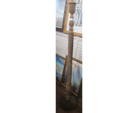 An Indian design carved sectional standard lamp