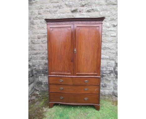 A 19th century mahogany linen press the top section fitted with one slide out shelf, width 49ins, height 81ins&nbsp;