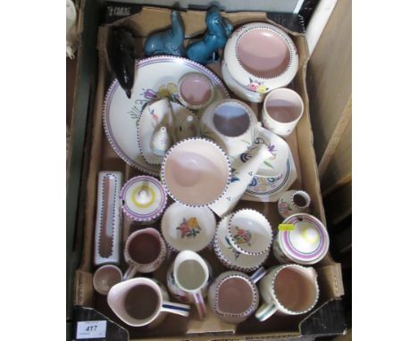 A collection of Poole pottery, decorated with flowers and some models