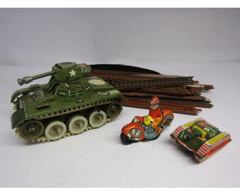 A West German tinplate clockwork Gama T65 tank together with a smaller tinplate tank, British made tinplate motorcycle and ri