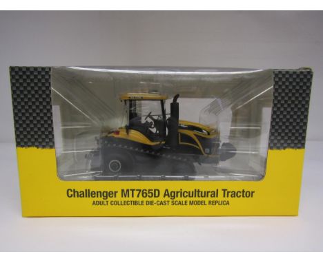 A boxed USK Scale Models 1:32 scale diecast Challenger MT765D Agricultural Tractor 