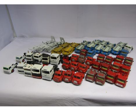 A collection of playworn diecast vehicle cabs and trailers including Corgi Bedford Tractor Units and Carrimore Car Transporte