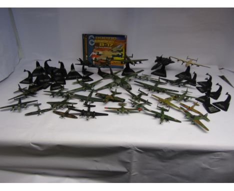 A collection of loose Atlas Edition diecast model military aircraft and stands 