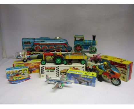 A collection of boxed tinplate vehicles to include Chinese Q.S.H. International Express Friction Locomotive, MF 334 Friction 