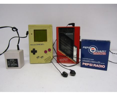 An unboxed Nintendo Game Boy handheld computer games console (a/f, discoloured and missing screen surround) with Tetris game 