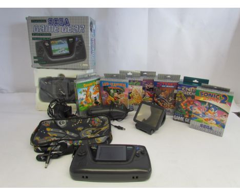 A boxed Sega Game Gear hand held computer games console and another unboxed example in carry case, both for repair, together 