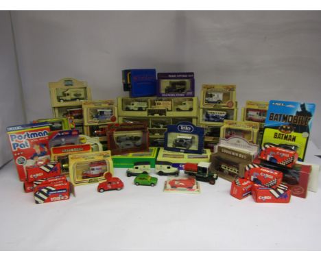 A collection of boxed, carded and loose diecast vehicles including Lledo Days Gone, ERTL Batmobile and Postman Pat Van, Match