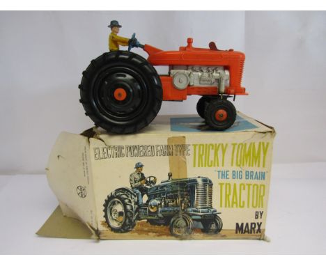 A boxed Marx battery powered Tricky Tommy The Big Brain Tractor, box poor 