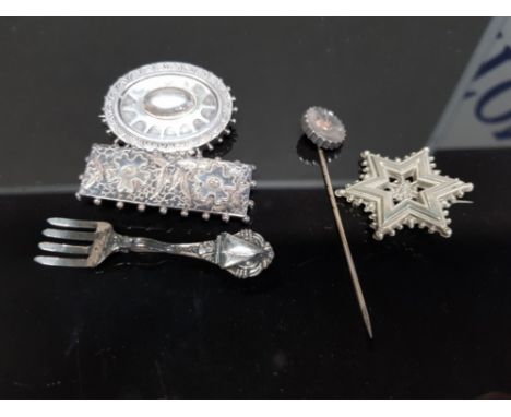 A STERLING SILVER BROOCH IN THE FORM OF A FORK A MEXICAN STAR SHAPED WHITE METAL ONES ETC