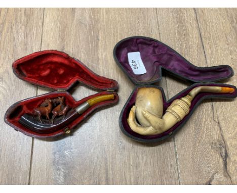 A MEERSCHAUM SMOKING PIPE CARVED AS A CLUTCHING HAND AND A SIMILAR CHEROOT HOLDER CARVED IN DEER IN FOREST