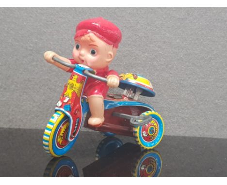 VINTAGE CELLUOID AND TIN LITHO WIND UP BOY ON BIKE GREAT CONDITION