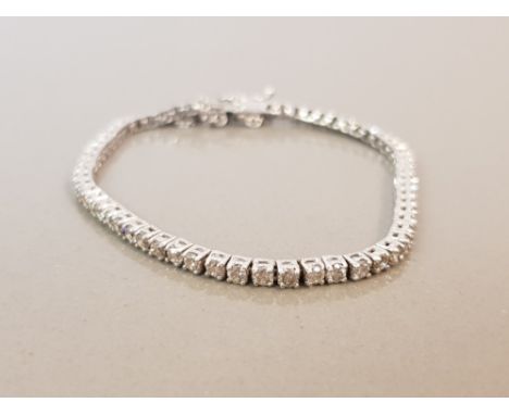 BEAUTIFUL 14CT WHITE GOLD DIAMOND TENNIS BRACELET APPROXIMATELY 3CTS WITH SAFETY CHAIN 8G 17CMS